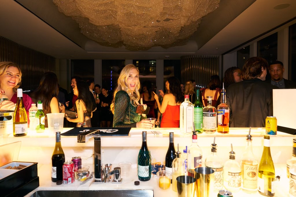 mobile bartending mobile bartender serving cocktail to beautoful young blonde at hudson yards plaza