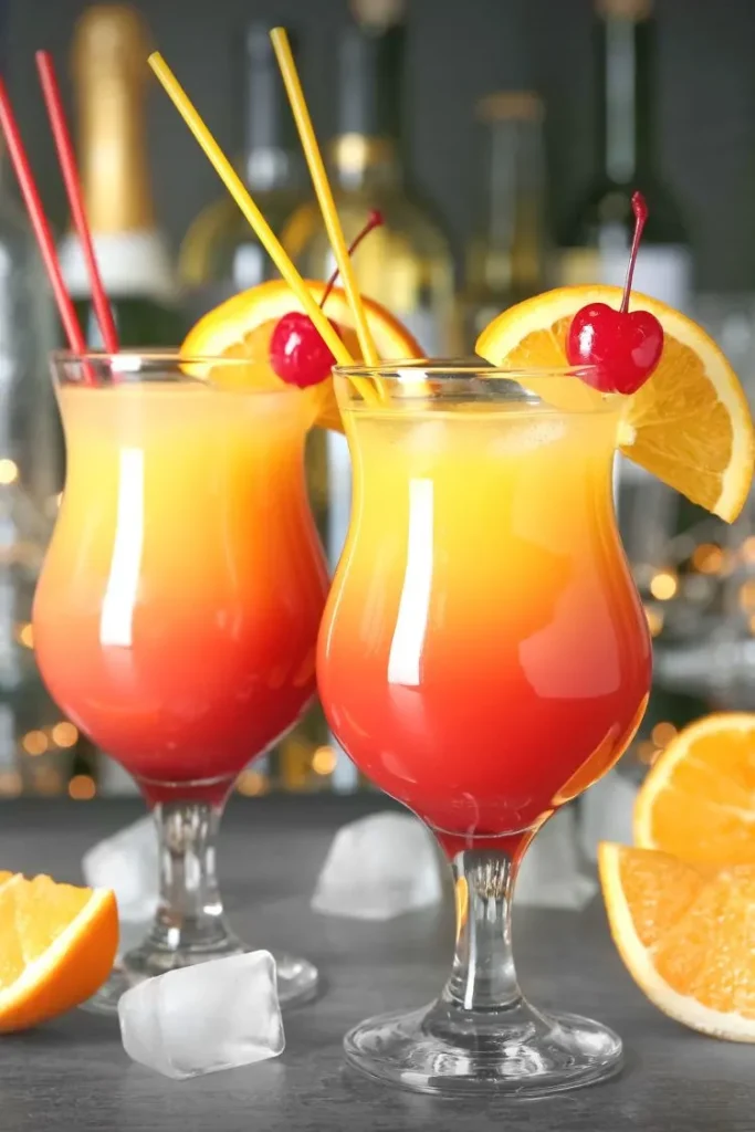 2 sex on the beach cocktails side by side with cherry and orange garnishes frozen drinks