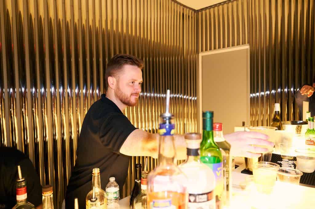 long-island-cocktail-bartender-serving-drink Cocktail bartender mixing drinks at a Long Island event