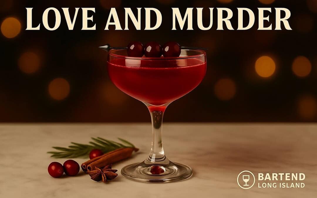 Love and Murder cocktail in a coupe glass filled with deep red liquor, garnished with three dark cherries on a sleek black pick, set on a marble surface with cranberries, cinnamon sticks, star anise, and warm golden holiday bokeh lights in the background, featuring the Bartend Long Island watermark.