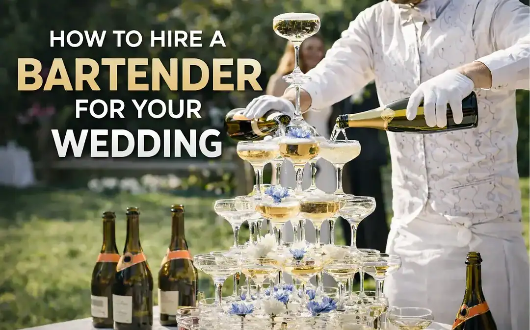 How to hire a wedding bartender for a reception, showing a professional bartender pouring champagne at a wedding