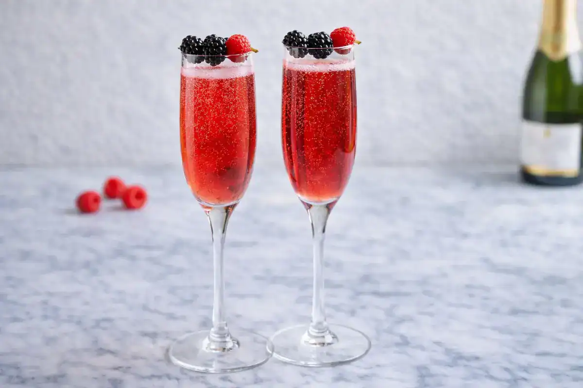 Kir Royale cocktail made with champagne and crème de cassis in a flute glass with a deep ruby color