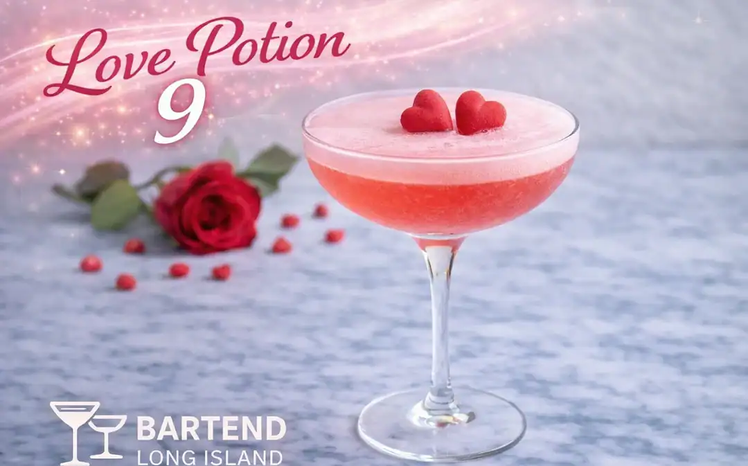 love potion 9 cocktail in coupe glass with pink garnish